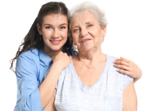 caregiver hugging senior