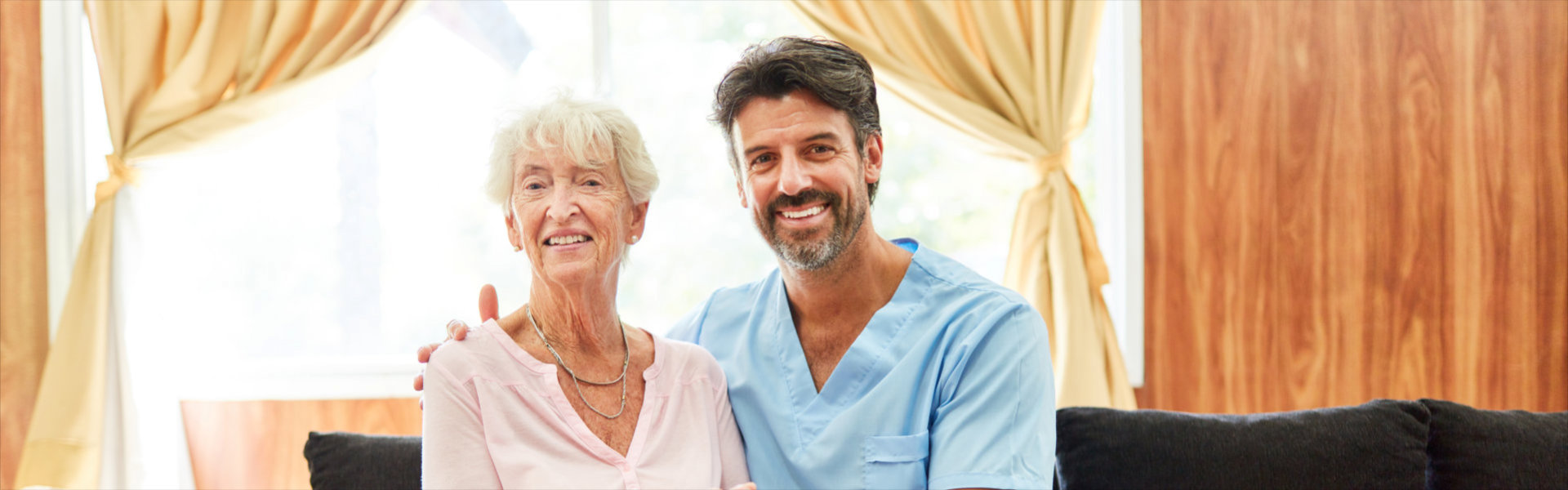 caregiver and senior smiling